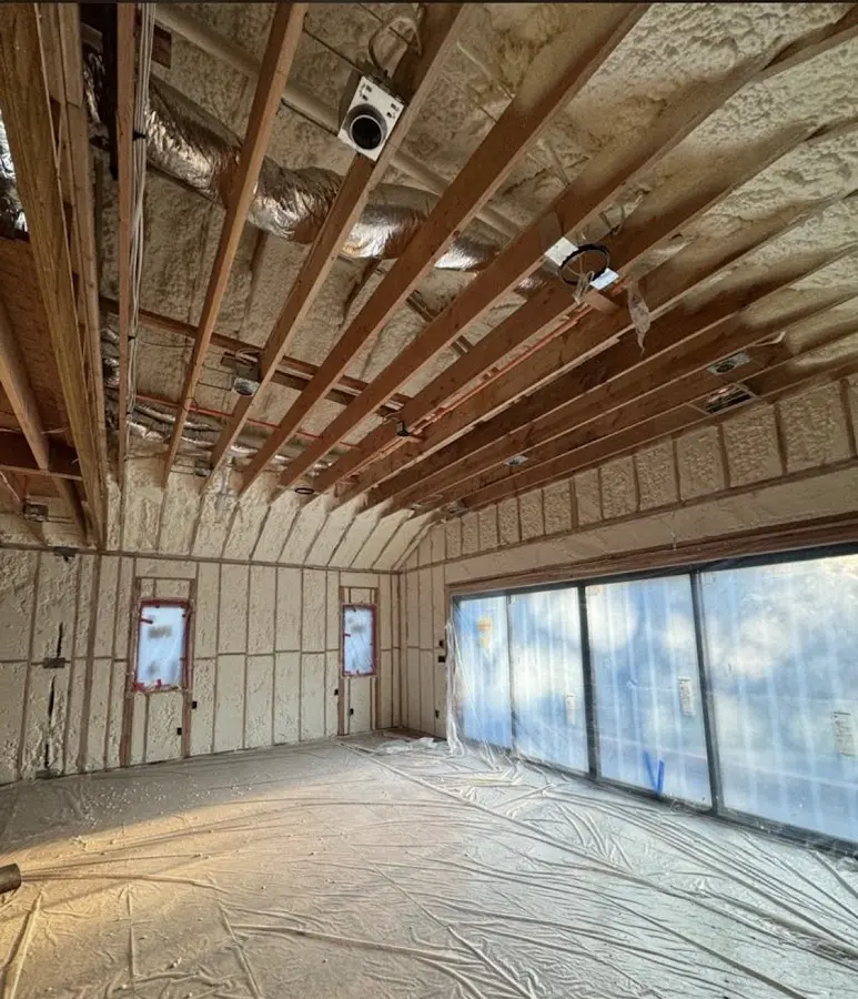 Interior walls and ceiling insulated with spray foam during new construction in Spanish Lake